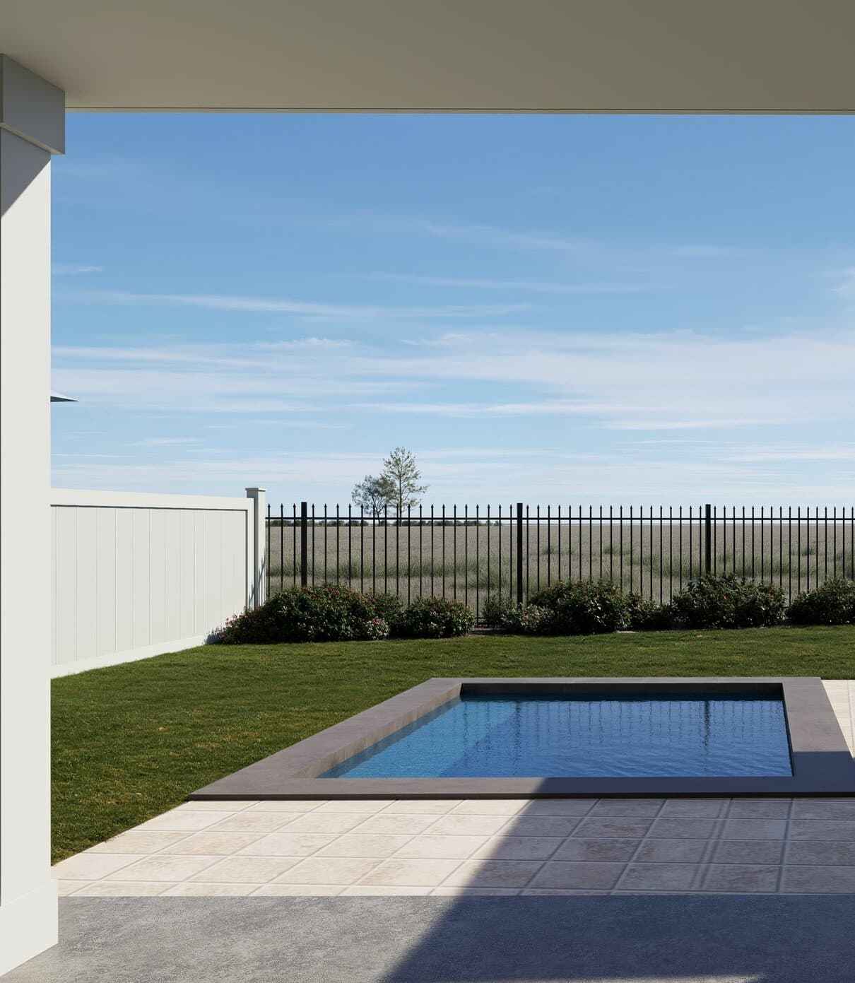 Private in-ground pool on the fenced ground-floor patio, with lawn beyond