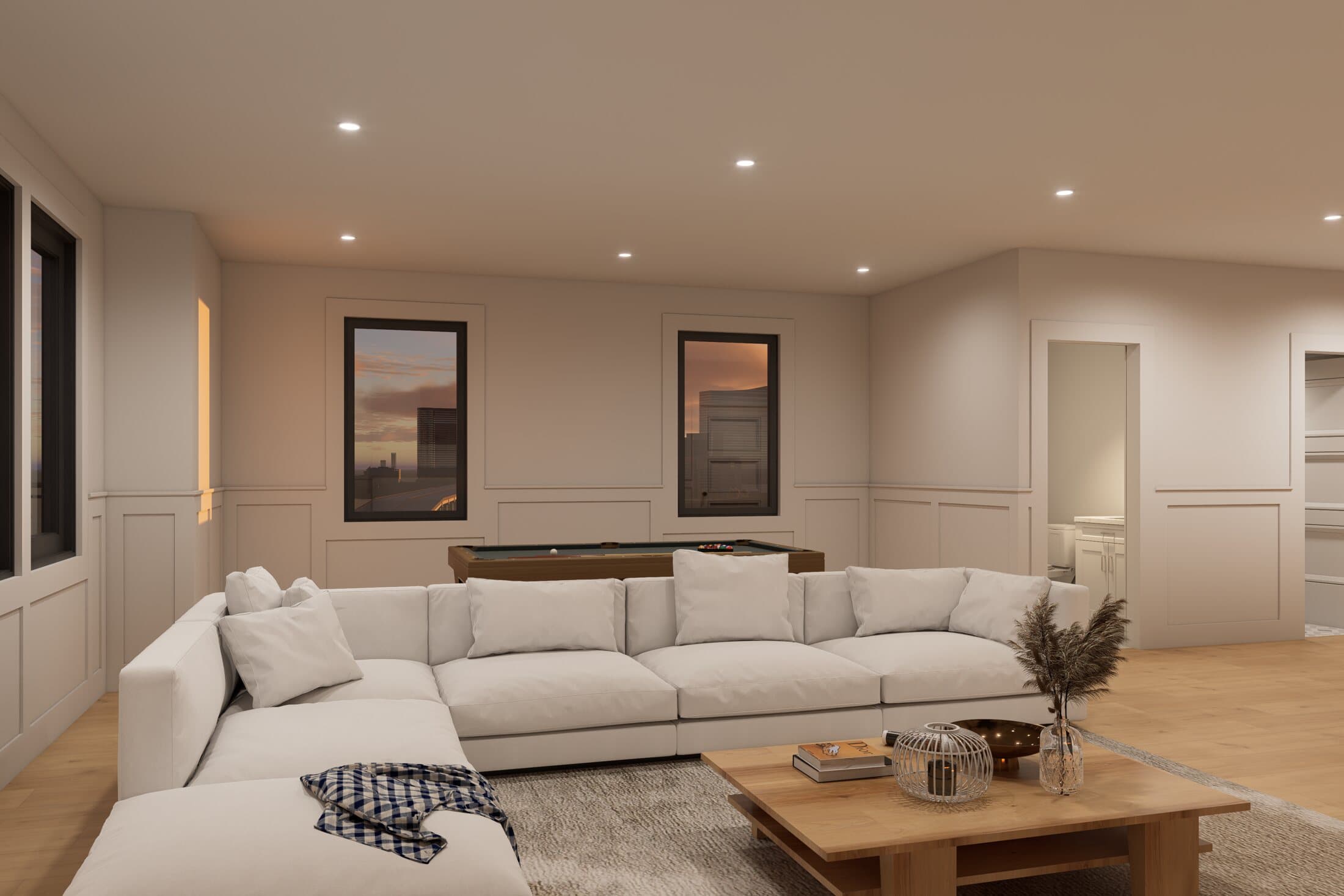 Cream sectional sofa and wide-plank flooring facing the windows