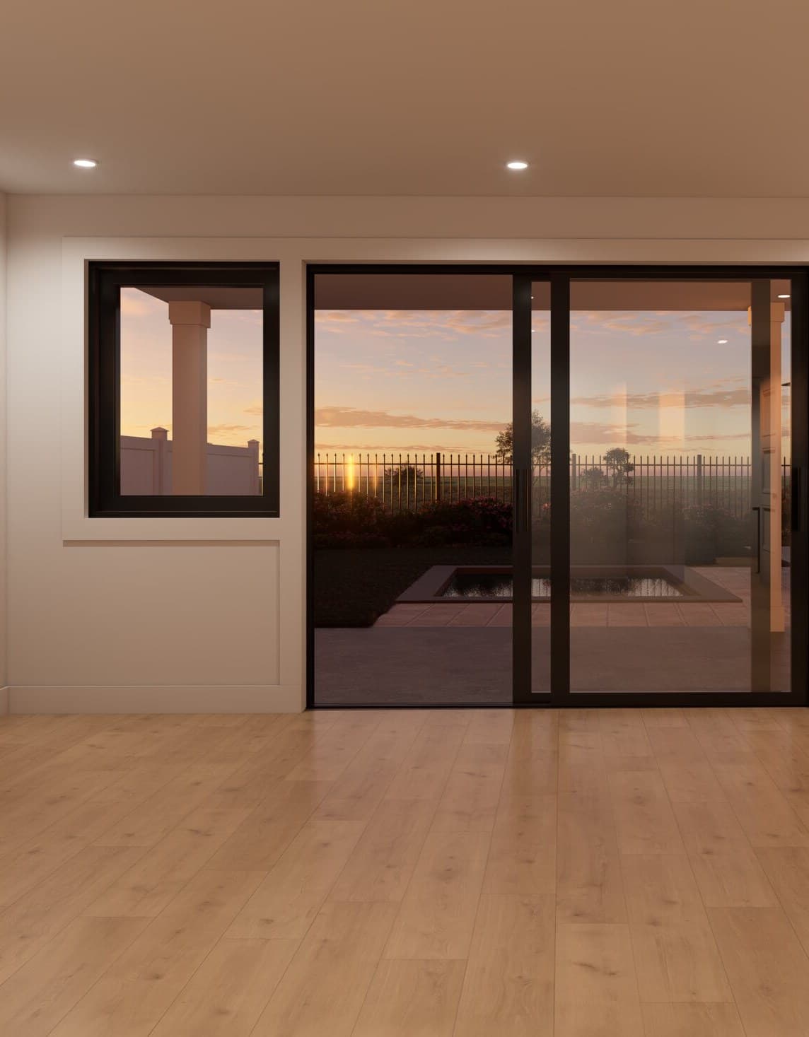 Living room with sliding glass doors open to the patio at sunset
